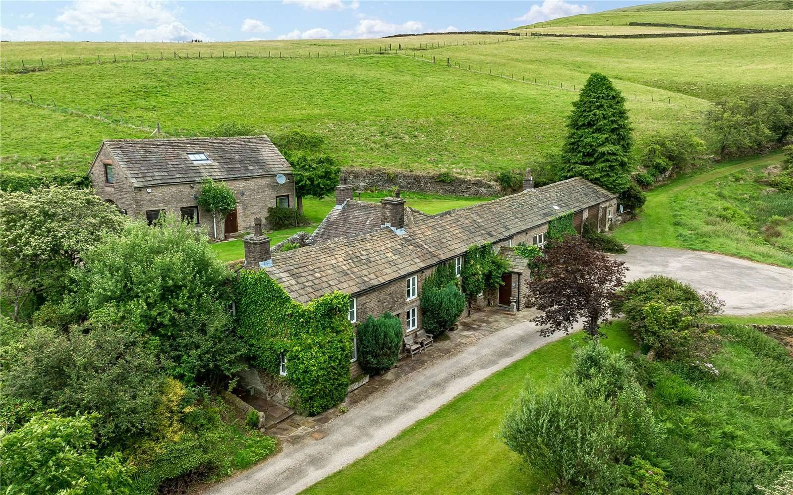 Farmhouse with outbuildings in Macclesfield