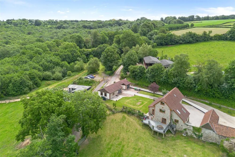 Axminster: barn conversion with outbuildings