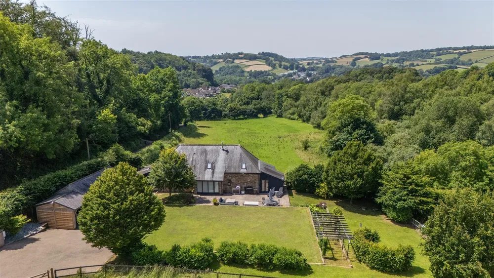 Barn conversion with outbuildings in Bampton