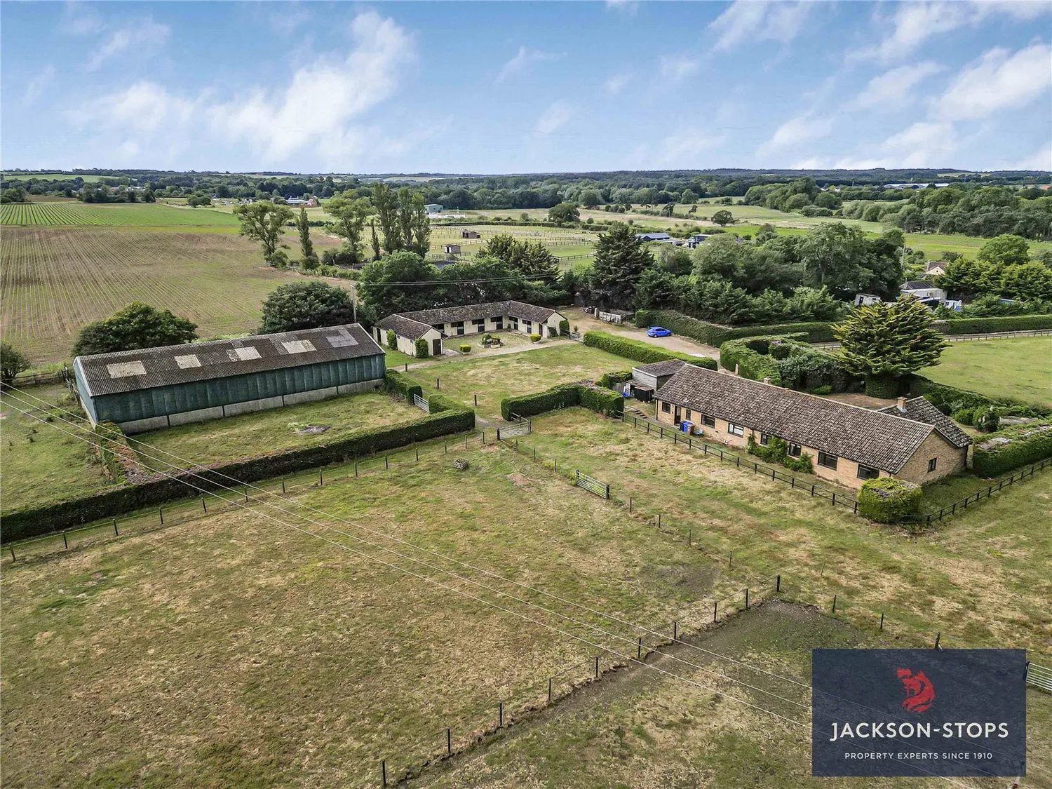Newmarket: bungalow with outbuildings