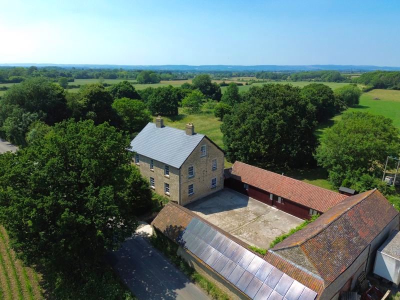 Farmhouse with outbuildings in On Market