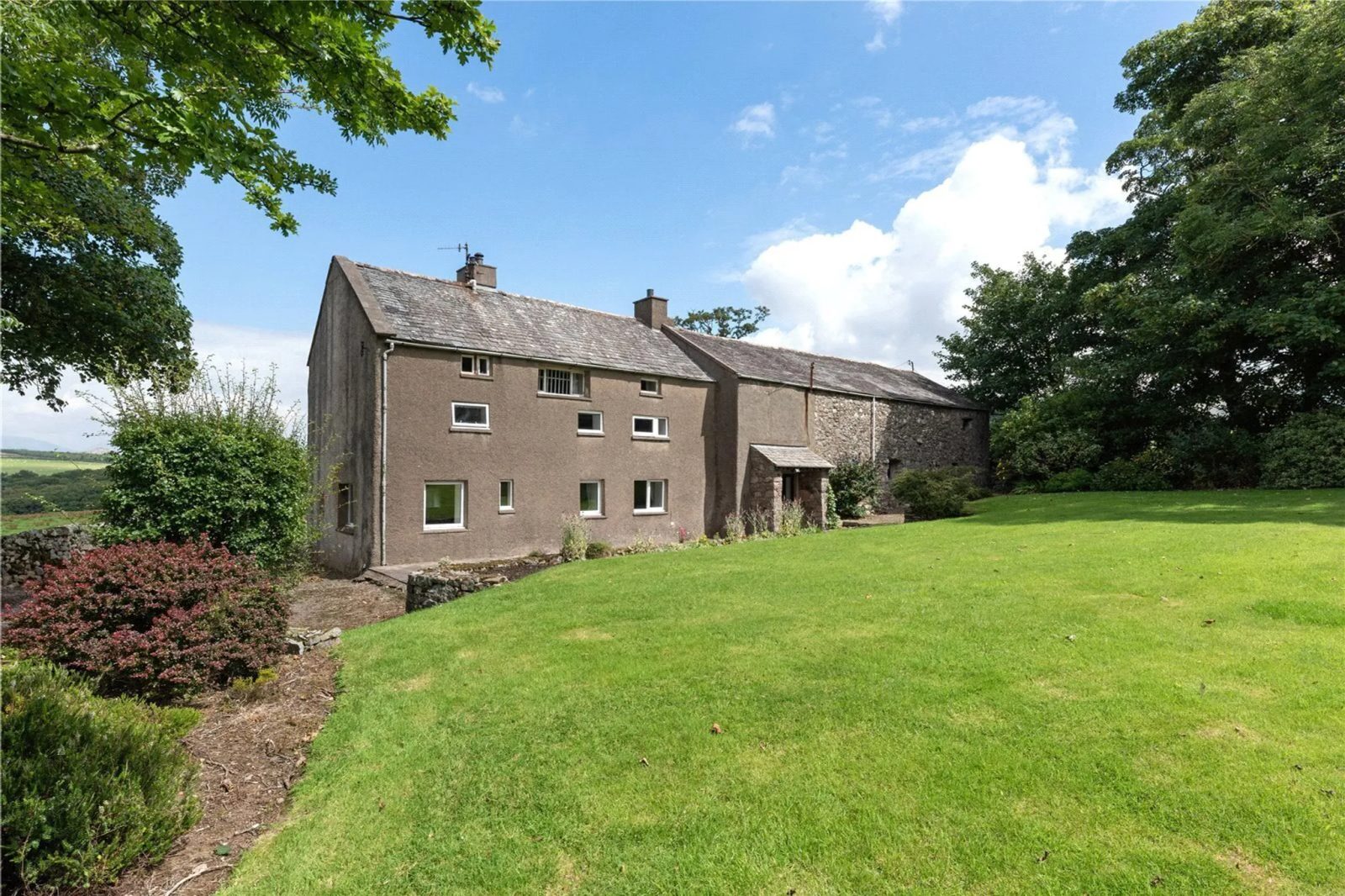 Farmhouse with outbuildings in Millom