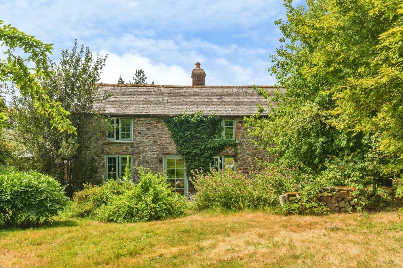 Roborough: farmhouse with outbuildings