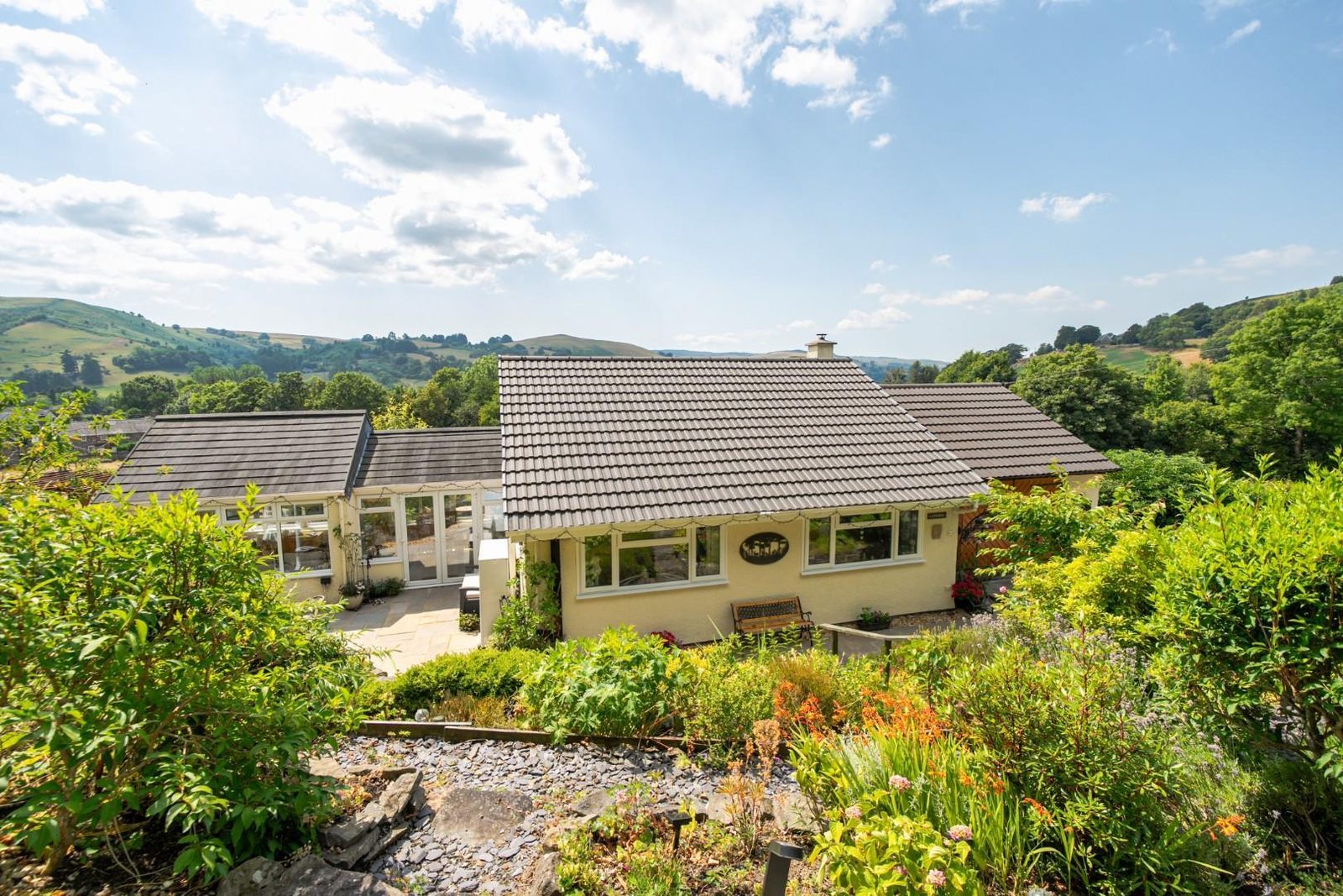 Welshpool: bungalow with outbuildings