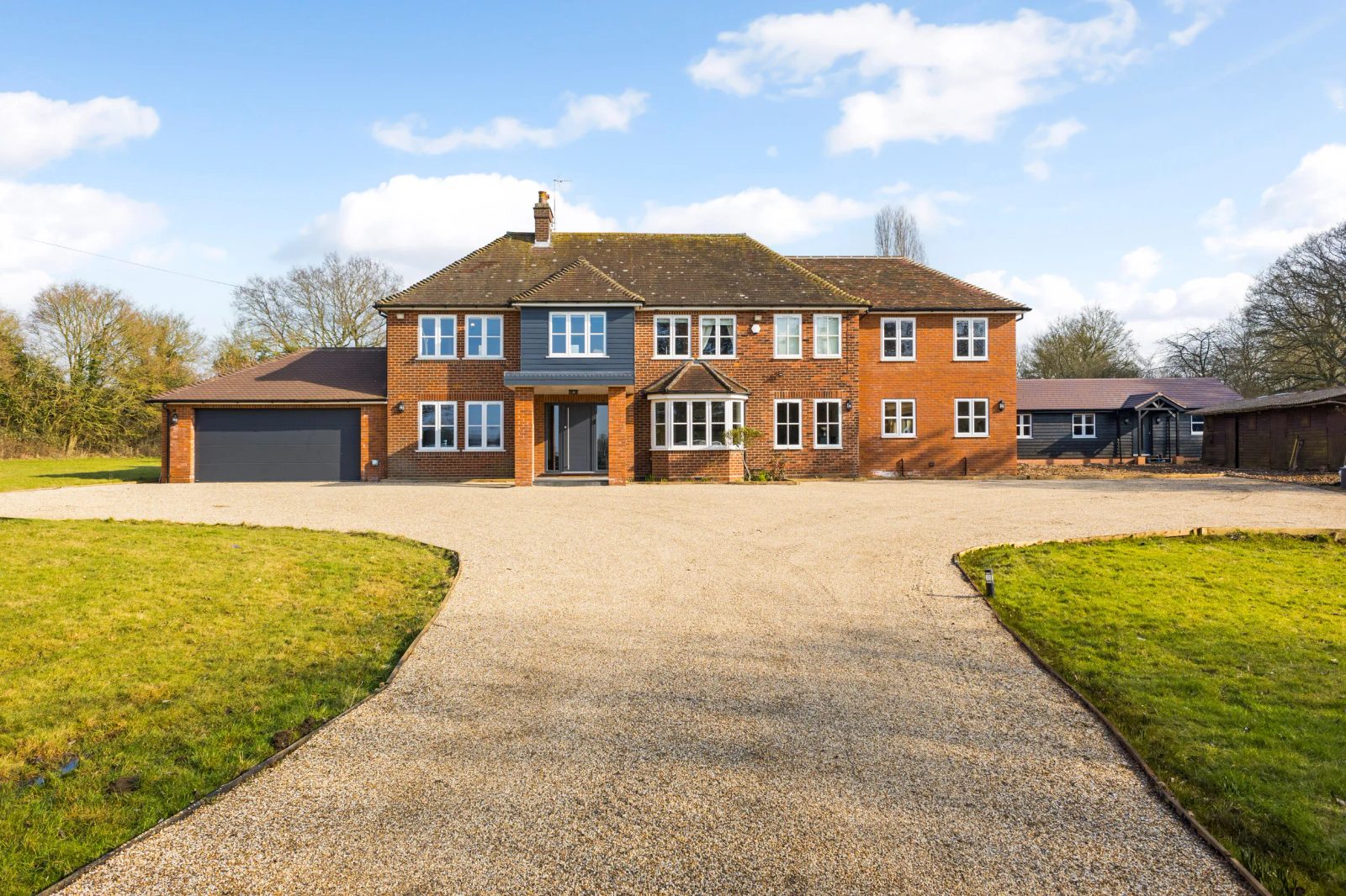 Stevenage: detached house with outbuildings