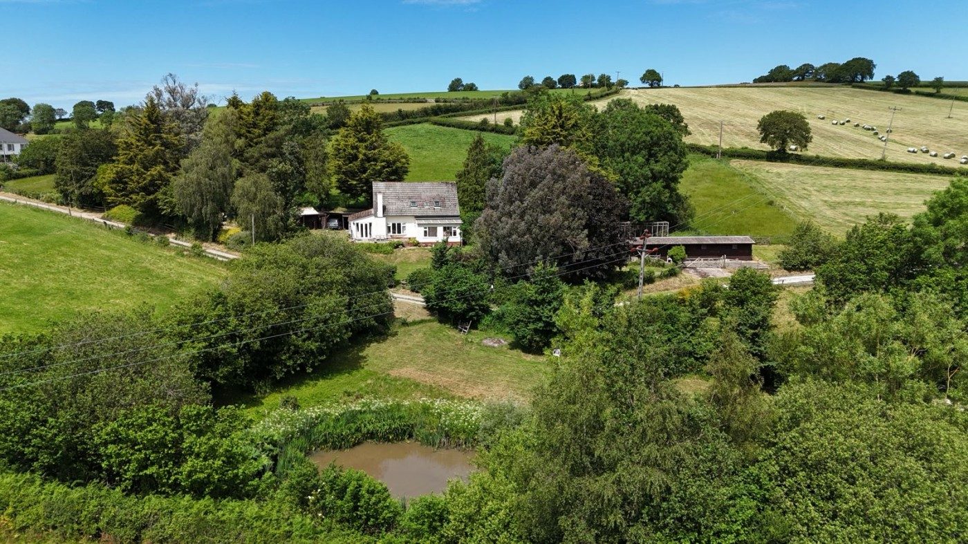 Detached bungalow with outbuildings in Exeter